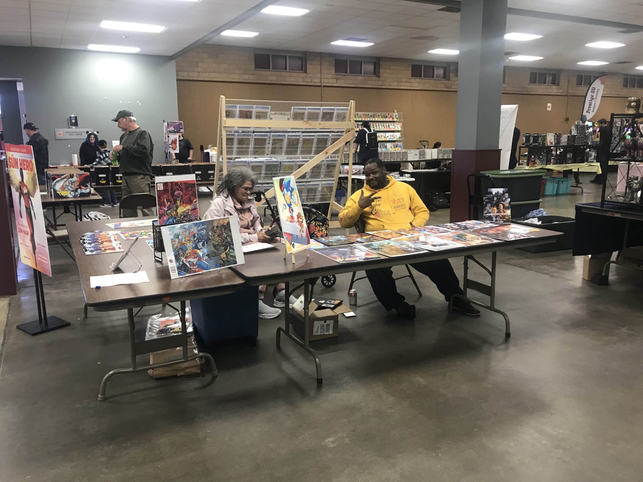 Dane Raphael Shobe at Topekarama 2024 with his comic book collection in Topeka, Kansas