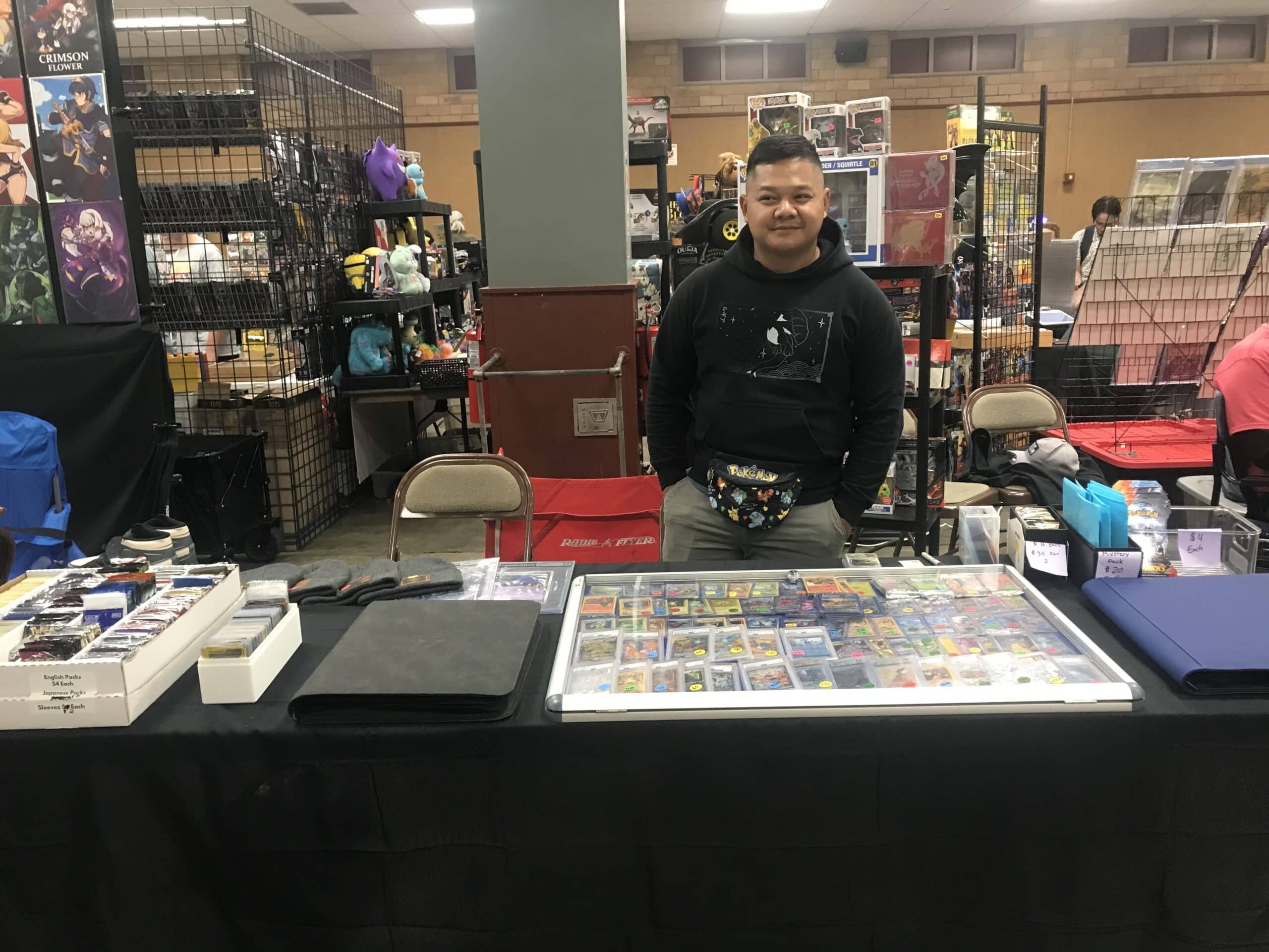 Tomg L’s Topekarama table featuring collectible cards and unique comic book designs