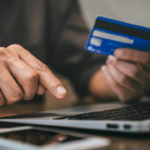 Person at a computer attempting to use someone else's credit card, symbolizing credit card fraud