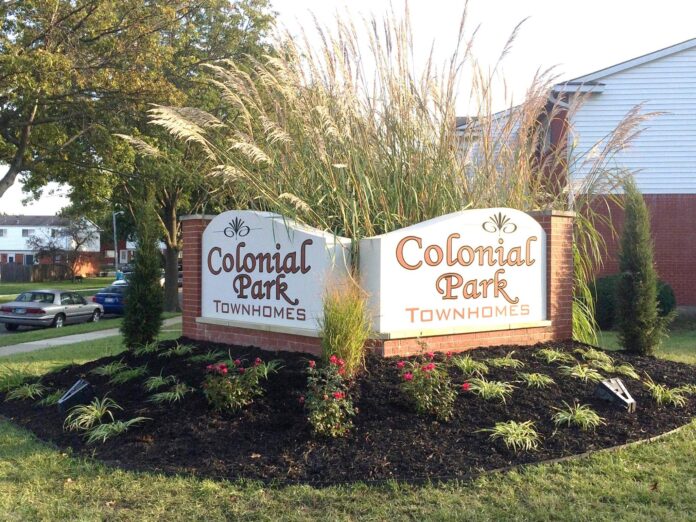 Colonial Park Townhomes Entrance Sign in Topeka, KS Colonial Park Townhomes entrance signage surrounded by landscaped greenery in Topeka, KS