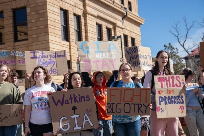 Dozens of students protested at the University of Kansas to object to changes at a dormitory.