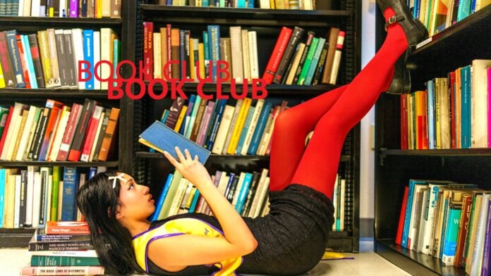 Young Graduate Reading in San Francisco Library By frank minjarez