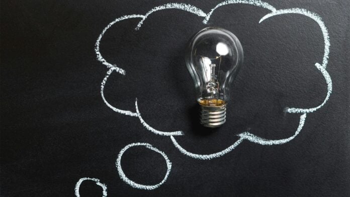 Clear Light Bulb Placed on Chalkboard By Pixabay