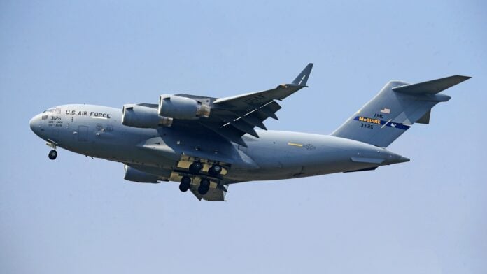 C17 flying in a blue sky By Jeffry S.