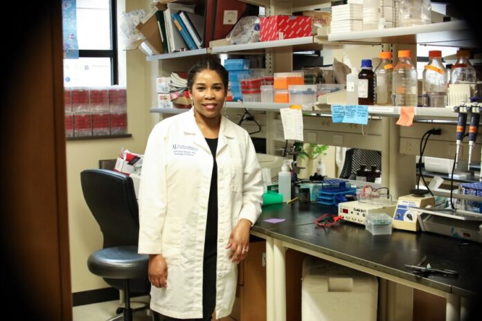 Dr. Joan Lewis-Wambi stands in her lab at the University of Kansas Medical Center