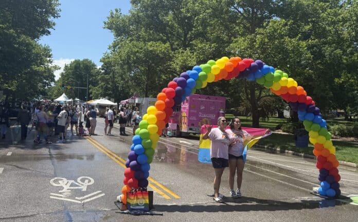 IMG_0183-scaled-e1751232972464-2048x1273 An arch of rainbow balloons greeted guest at the June 7, 2025, Lawrence Pride event in downtown Lawrence. (Clay Wirestone/Kansas Reflector)