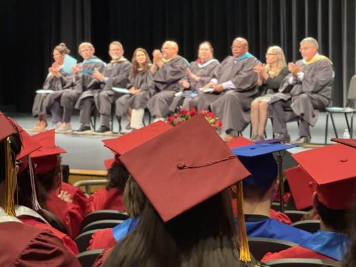 download (25) Wichita school district graduates gather for a summer ceremony held each year after summer school. Students get their diplomas in June after completing required credits through credit recovery programs.