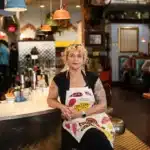 Meg Heriford, owner of Ladybird Diner in Lawrence, sits at the counter in her restaurant. She said she won't be able to afford health insurance this year if federal subsidies expire.