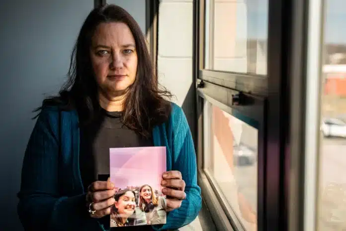 download (40) Jill Clements holds a photo of her daughter, Page. She finished high school early so she could move to Minnesota, where gender-affirming care is more accessible.