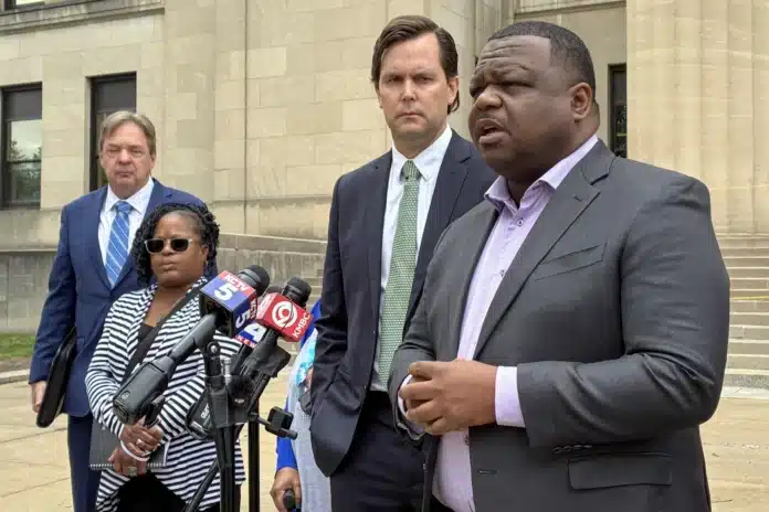 Erica Adair, Charles Adair's sister, and lawyers representing his family speak outside the Wyandotte County courthouse Wednesday after viewing body camera footage of the moments leading up to his death for the first time.