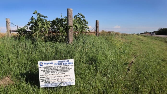 A notice for a public hearing is posted at the intersection of G and 190 roads at the western edge of Emporia. The city has annexed the site for a proposed hyperscale data center, and a June 23, 2026, hearing seeks for public comment before the local planning commission. (Photo by Max McCoy/Kansas Reflector)