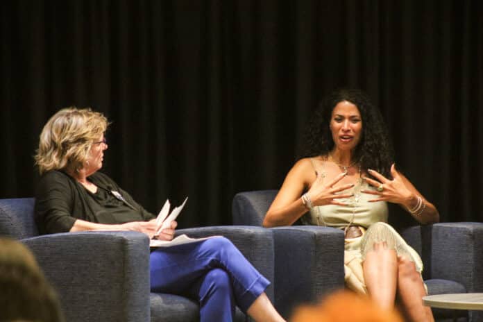 TraffickingEvent060226_003-2048x1365 International Public Policy Institute director and survivor advocate Sharon Sullivan speaks with survivor and advocate Lisa Phillips on a panel June 2, 2026. (Photo by Maya Smith for Kansas Reflector)