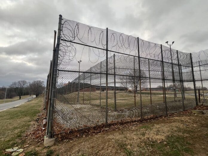 Barbed wire and fences surround the Charles H. Hickey Jr. School, a juvenile detention center in Maryland. The state’s recent changes to its juvenile justice laws aim to reduce the number of young people entering the adult criminal justice system while expanding rehabilitative services. (Photo by Amanda Watford/Stateline)