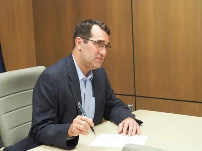 Republican U.S. Rep. Derek Schmidt, seen March 12, 2026, at the Kansas Secretary of State’s Office in Topeka, refused to sign onto a procedural move to bypass House leadership and force a vote on legislation to bring transparency to the Epstein files. Democrat Don Coover, who is running against Schmidt, criticized Schmidt’s decision. (Tim Carpenter/Kansas Reflector)